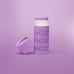 Load image into Gallery viewer, A single purple Nöz sunscreen stick in front of a purple background.
